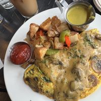 Mushroom omelet 🍄‍🟫 (with as side of hollandaise)   at The Wayward Vegan in Seattle