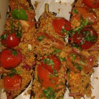 I bought these as a take out lunch. Baked eggplant with a bulgar wheat and chermoula stuffing. Yum. at River Kitchen in Hamilton