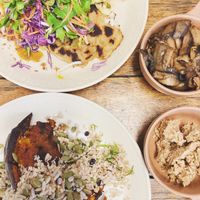 Miso pumpkin with cauliflower cous cous and daikon fritter dumplings with a side of mushrooms and almond feta  at Straight Up in Hobart