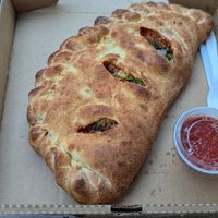 Vegan stromboli with vegan cheez, mushroom, broccoli, yellow onion, and classic Italian sauce at Glass Nickel Pizza Co. – Brookfield  in Brookfield