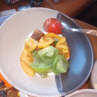Salad tomato with cheese at Kitty Hawk Rooftop Bar and Restaurant in London