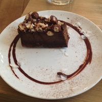 Chocolate and hazelnut cake (a few mouthfuls already taken) at MyRaw Cafe in Prague