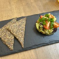 Avocado tartare split into two portions  at MyRaw Cafe in Prague