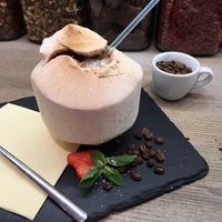 Smoothie in Young Coconut. Fruits or chocolate with coffee  at MyRaw Cafe in Prague