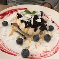 Pancakes with cashew cream and blueberries at MyRaw Cafe in Prague