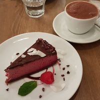 chocolate raspberry cheesecake with hot chocolate at MyRaw Cafe in Prague