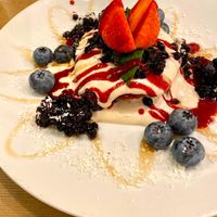 Pancakes with cashew cream and blueberries at MyRaw Cafe in Prague