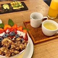 Awesome breakfast with coffee, green tea und fresh orange juice. at MyRaw Cafe in Prague