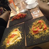 Up:Raw bruschetta, On the left: Raw quatro formaggi pizza, On the right: Raw margherita pizza at MyRaw Cafe in Prague