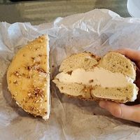 Garlic bagel with vegan cream cheese at Bagel Bakery in Gainesville