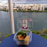 Prepared foods are in a display near the cashier. at Fresh Mart - Condado in San Juan