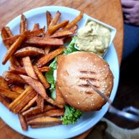'Fishstick' burger with fries and joppie sauce at Kruemelkueche in Duisburg