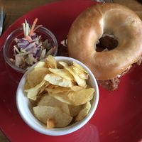 Vegan sausage and bacon bagel with coleslaw  at The Old Hardware Shop in Liverpool