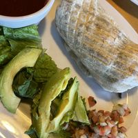 Veggie burrito with avocado and red chili sauce on the side    at Notchtop Bakery and Cafe in Estes Park