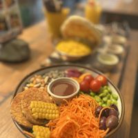 Vegan veggie bowl. Behind my husbands chicken. We always have a challenge finding what we both like to eat.   at Ona Beach Bar in Roses
