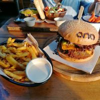 Fries with tahini mayo and vegan burger at Ona Beach Bar in Roses