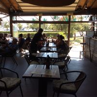 Out of the midday sun. Enjoy a cool drink or hot curry ?  at Ona Beach Bar in Roses