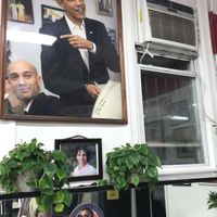 Obama portrate above the table he famously ate at, after winning the ‘08 election at Ben's Chili Bowl in Washington