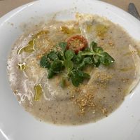 Raviolis de setas con salsa de queso vegano  at Km.0 in San Sebastian