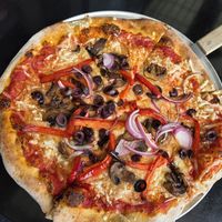 Mediterranean Pizza with vegan cheese at Brickyard Hollow in Brunswick