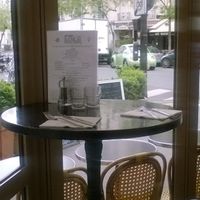 une petite table de deux, intime et typiquement parisienne at Brasserie LoLa in Paris