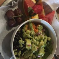 Can’t remember the name of this bowl. Has quinoa, avocado, black beans, peppers, and sweet potatoes. A side of fruits.  at The Corner Store in Plant City