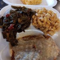Smothered chicken, corn bread, collard greens and mac and cheese at Go Vegan Grill in Decatur