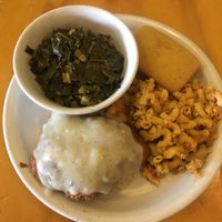 Yum! Smothered fried chicken with gravy and mac n cheese, collard greens and cornbread  at Go Vegan Grill in Decatur