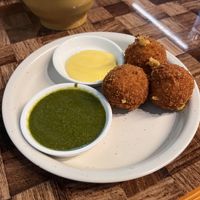 Cheesy potato balls with mint chutney and “honey” mustardd  at Seriously Vegan in Austin