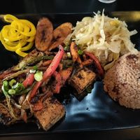 Jerk Tofu with fried plantains, cabbage, rice and peas. at Wha Gwaan Jamaica Jamaica in Tampa