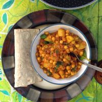 Spinach and chickpea curry with a gluten free vegan wrap.  at Mudlarks Garden Cafe in Hertford