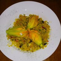 Vegetable Cous Cous with zucchini flowers stuffed with vegan cheese. at Fargo in Sevilla