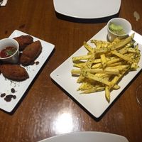 Croquettes and garlic fries- with real garlic!!!yum! at Fargo in Sevilla