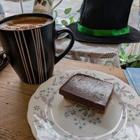 Chai latte with oat milk and chocolate and coconut torte. at Blyde Welcome in Shetland Islands