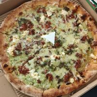 Whole wheat, double basil pesto, red pesto, vegan mozzarella, goat cheese, parmesan, pine nuts at Pizza Di Rocco in Abu Dhabi