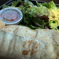 Tofu scramble burrito with salad at The Dancing Dog in Urbana