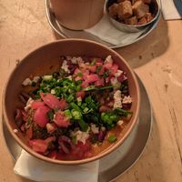 Vegan kzizot-pattie - served on polenta and in a tomato sauce  at Alegria in Tel Aviv