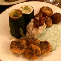 Baked zucchini with a ricotta filling, crispy roasted potatoes, turnips (I think) and rice with an herbed yogurt sauce at Bites and Wines in Antwerpen