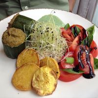 Filled courgette with baked potato and salad. at Bites and Wines in Antwerpen