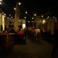 Outside seating area by night at Zapfhahn in Bamberg