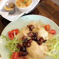 Biscuits and gravy with a side of grits 😋 at Dharma Southern Chick'n in Orlando