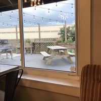 Inside looking out at the garden ✨ at Dharma Southern Chick'n in Orlando