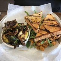 Fried green tomatoes sandwich with roasted brussels  at Dharma Southern Chick'n in Orlando