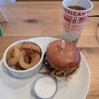 Steakhouse Burger, onion rings, and iced tea at Veggie Grill by Next Level - Tustin Marketplace in Irvine