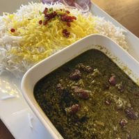 vegan ghormeh sabzi with saffron rice topped with dried barberries and slivered pistachio   at Santoor in Wien