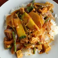 Stir fried vegetables with red coconut milk curry + tofu, 20k at Lai's Place in Luang Namtha