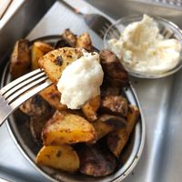 Roasted potatoes with the best garlic sauce. Honestly if you haven’t tried this garlic sauce you haven’t tried garlic sauce at all. at Chwast Food in Warsaw
