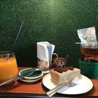 Sea backthorn water, pu erh Tea, chickpea and caramel cake at KIRAS - Totoriu 7 in Vilnius