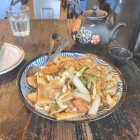 Flat noodles with tofu and pot of Jasmine tea  at United Dumplings in San Francisco