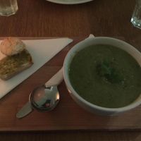 Vegan zucchini and lemon soup with bread side at Black Bear Cafe in Belfast